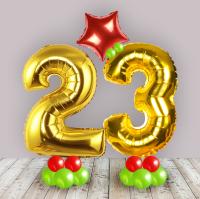 Золотая цифра двадцать три на подставке