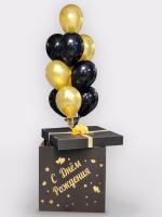 Чёрная коробка с золотой надписью и фонтаном из шаров